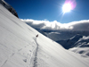 Skiers break fresh tracks high in the Austrian Alps above Zurs, headed to famed backcountry skiing. Â The Arlberg region is noted for it's off piste and back country skiing