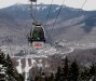 Loon Gondola nears summit of Loon Peak with valley in background