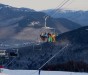 Skiers and Riders on North Peak Quad at Loon Mt.