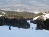 Skiers descending from summit of Loon Mountain in New Hampshires White Mountains