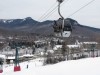 Loon Mt. Gondola near base with Loon Mountain Club ski in / ski out Hotel & resort background