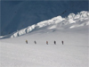 Courmayer, IT-Skiers trek in the Valley Blanche on the French/Italian boarder descending to Chamonix, France