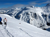 Skiers descend in fresh powder in the Arlberg region of Austria
